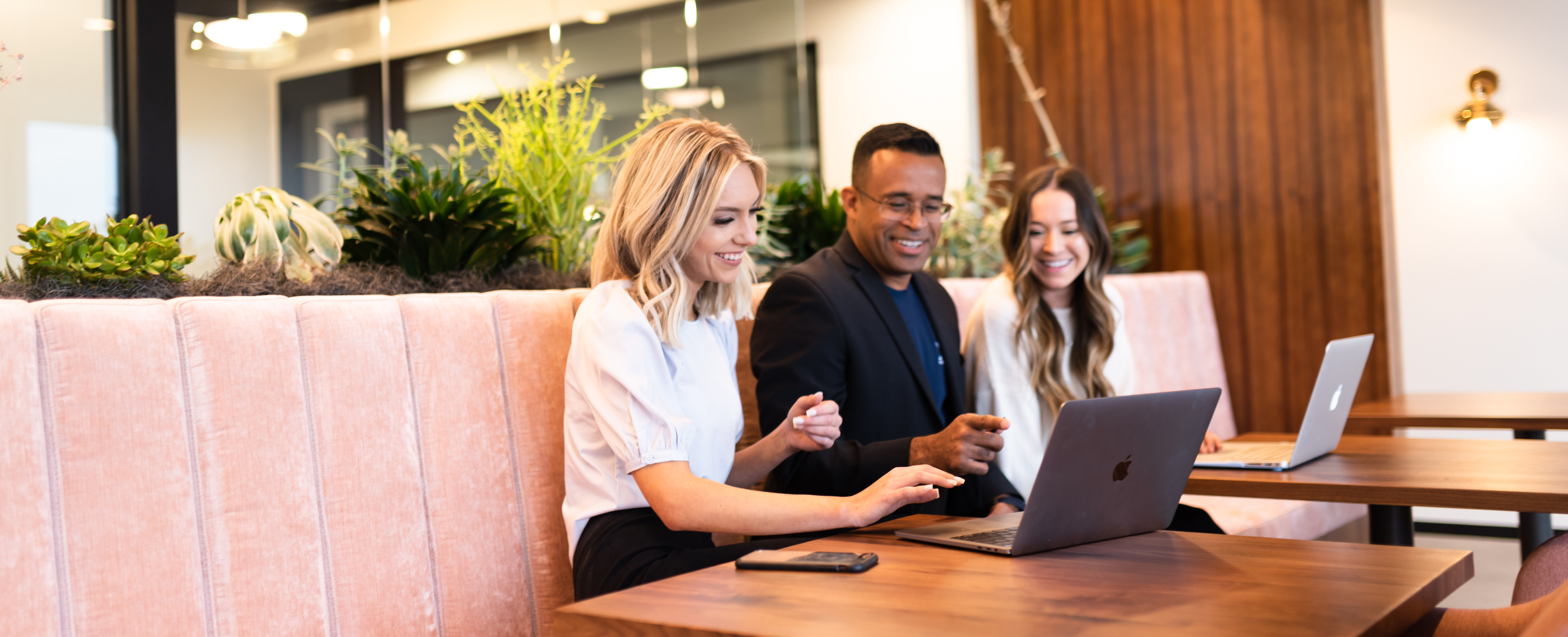 ASU Alumni working in a public workspace